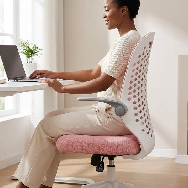 A woman using a laptop on a Liftable Swivel Study and Office Chair with Breathable Back in a bright home office.