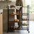 Modern kitchen with Brushed & Polished 304 Stainless Steel Storage Cabinet displaying fruits and bread.