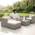 5-Piece Modular Rattan Outdoor Sectional Set with woman relaxing in a garden setting.