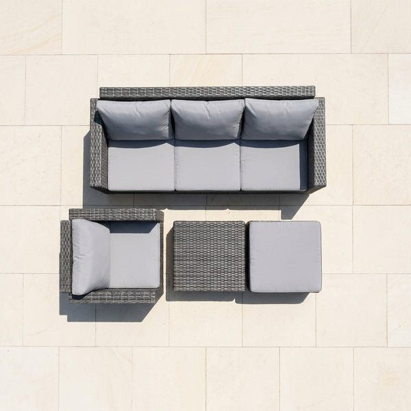 4 Piece PE Wicker Outdoor Patio Furniture in Grey, featuring a sofa, armchair, ottoman, and coffee table.