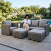 4 Piece PE Wicker Outdoor Patio Furniture in Grey featuring sofa, armchair, ottoman, and coffee table with a relaxed woman.