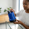 45W 2500L-H Flow Aquarium Submersible Water Pump being held by a person near an aquarium.