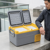 12-24V Portable Fridge Cooler Box 25L open with two compartments, ideal for travel and camping use.