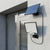 108-LED Split Solar Flood Light PIR Motion Remote mounted on a wall with solar panel.