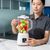 Woman using a Digital LCD Countertop Blender with mixed fruits in the jug, display timer visible.
