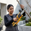 Woman using a Cordless Lithium Mini Chainsaw Power Tool Set to trim a tree branch in a garden.