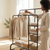 120cm 3-Tier Double-Rail Drying Rack With Wheels holding neatly arranged clothes and towels.