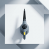 Top view of a 1200W Handheld Steam Cleaner on a white surface, showcasing its compact design and efficient nozzle.