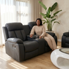 Modern Black Comfort Sofa Set featuring a woman relaxing with a drink, demonstrating comfort and style in a contemporary living space.
