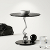Sculptural Marble-Look Round Side Table featuring marble top, stylish base, and decorative accessories, ideal for modern interiors.