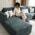 Modern Plush Lounge Couch with Cushions featuring a woman relaxing with a tablet on a soft, comfortable sectional.