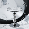 Round Marble-Look Coffee Table with Decorative Metal Base showcasing a modern design in a stylish setting.