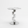 Round Modern Accent Side Table with a round marble top and unique chrome base structure on a white background.