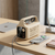 50000mAh Portable Power Bank with Multiple Charging Ports connected to a smartphone on a wooden table.