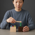 Wooden Magnetic Worm Catching Game Educational Toy with a child using a magnetic wand to catch colorful worms.
