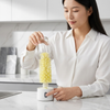 Woman using Electric Cleaning Brush with Rotating Brush Head for effective cleaning.