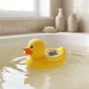 Digital Floating Baby Bath Duck Thermometer floating in water displaying temperature.