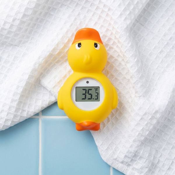 Digital Floating Baby Bath Duck Thermometer showing temperature reading of 36.3°F on a bath towel.