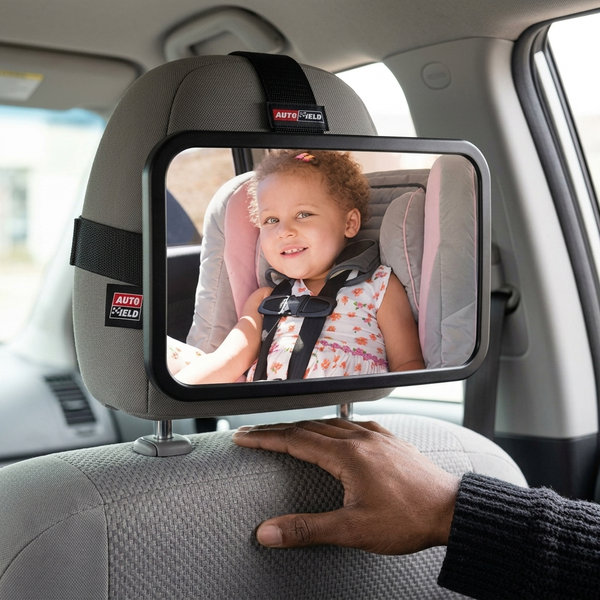 Rear Seat Baby Car Mirror with Adjustable Strap showing a child in a car seat with a clear view for the driver.