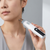 Handheld Electronic Massage Pen with Digital Display being used on the neck for targeted massage.