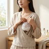 MV-362 Wearable Electric Breast Pump used by a woman in a comfortable setting for hands-free milk expression.