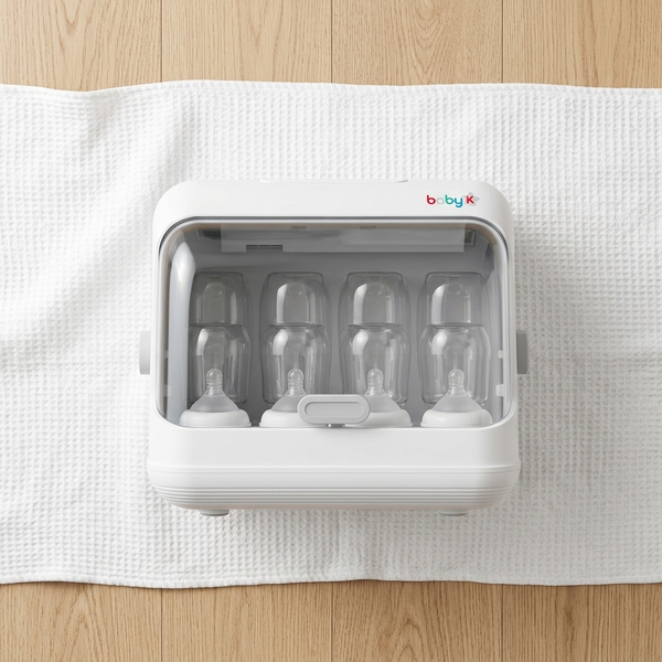 Automatic Baby Bottle Sterilizer and Dryer with multiple bottles inside, featuring a transparent lid and compact design.