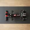 Indoor Cycling Spin Bike with Adjustable Seat viewed from above on a gym mat.