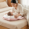Mom and baby using Long Plush Baby Pillow with Printed Design for comfort and support during playtime on the bed.