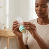 Effortless Feeding with Squeeze Silicone Baby Spoon held by a woman demonstrating its easy use for feeding.