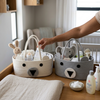 Woven Cotton Rope Bear Diaper Caddy featuring cute bear faces and organized nursery essentials.
