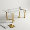 Modern White Marble-Look Dining Table with Gold Legs featuring glossy marble tabletop and elegant gold pedestal legs.