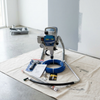 High-Pressure Electric Airless Paint Sprayer Kit with accessories on a drop cloth in a bright room.