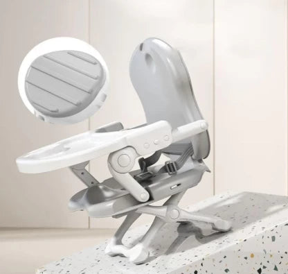 Adjustable Baby Booster Feeding Chair in a sleek grey design with an adjustable tray for comfortable mealtimes.