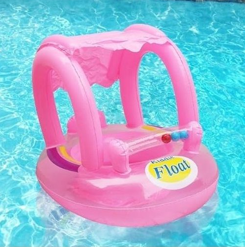Kids Baby Boat with Sun Shade floating in a swimming pool, designed for comfortable water play for young children.