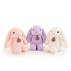 Plush Bunny Toy collection featuring a pink, purple, and white bunny stuffed animal, perfect for children.
