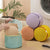 Small Round Mesh Laundry Bag in pastel colors, perfect for organizing laundry items during wash cycle.