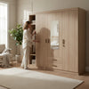 3-Door Wooden Wardrobe with Mirrored Center & Drawers in a stylish bedroom setting with a woman interacting with it.
