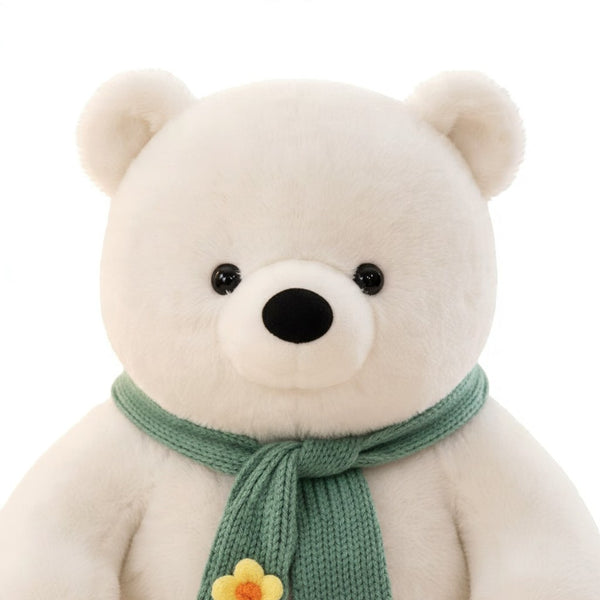 Plush Teddy Bear Unit with a green scarf and flower detail, perfect for gifts and companionship.