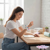 A girl wearing a Slap Unicorn Bracelet while studying at a desk, showcasing the colorful unicorn design.