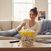 Person enjoying popcorn from a 2XL Classic Popcorn Bucket while relaxing on a couch.