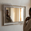 Modern Geometric Decorative Wall Mirror featuring a stylish multi-paneled design reflecting light and creating space.