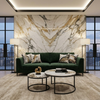 Round Marble Effect Nesting Coffee Tables in a modern living room with green sofa and marble wall.
