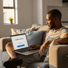 Person shopping online with a laptop at home, exploring buy now pay later South Africa options.