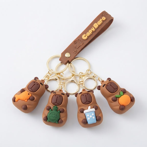 3D Silicone Capybara Keychain with Wrist Strap featuring cute capybara designs and colorful accessories.