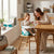 A mother and toddler enjoying mealtime in a Summer Infant Sit in Style Booster Seat at a dining table.