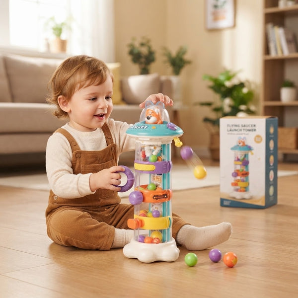 Child playing with Flying Saucer Launch Tower Toy, engaging with colorful balls on a launch tower in a bright indoor space.