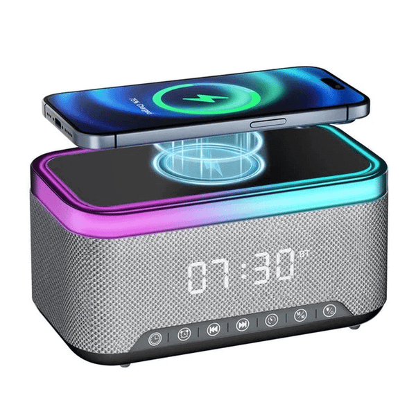 Smart Multifunction Alarm Clock with Bluetooth Speaker showing a phone charging wirelessly on top.