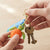 Colorful 3D Rubber Sea Turtle Keychain attached to keys, showcasing its playful design and vibrant colors.