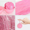 Disposable Raincoat Ball in a pink container, showcasing the compact design and lightweight rain protection.
