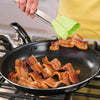 Using 2 in 1 Clever Tongs to flip crispy bacon in a skillet on the stove.